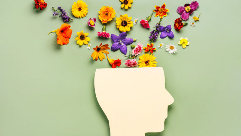 head figure with flowers coming out